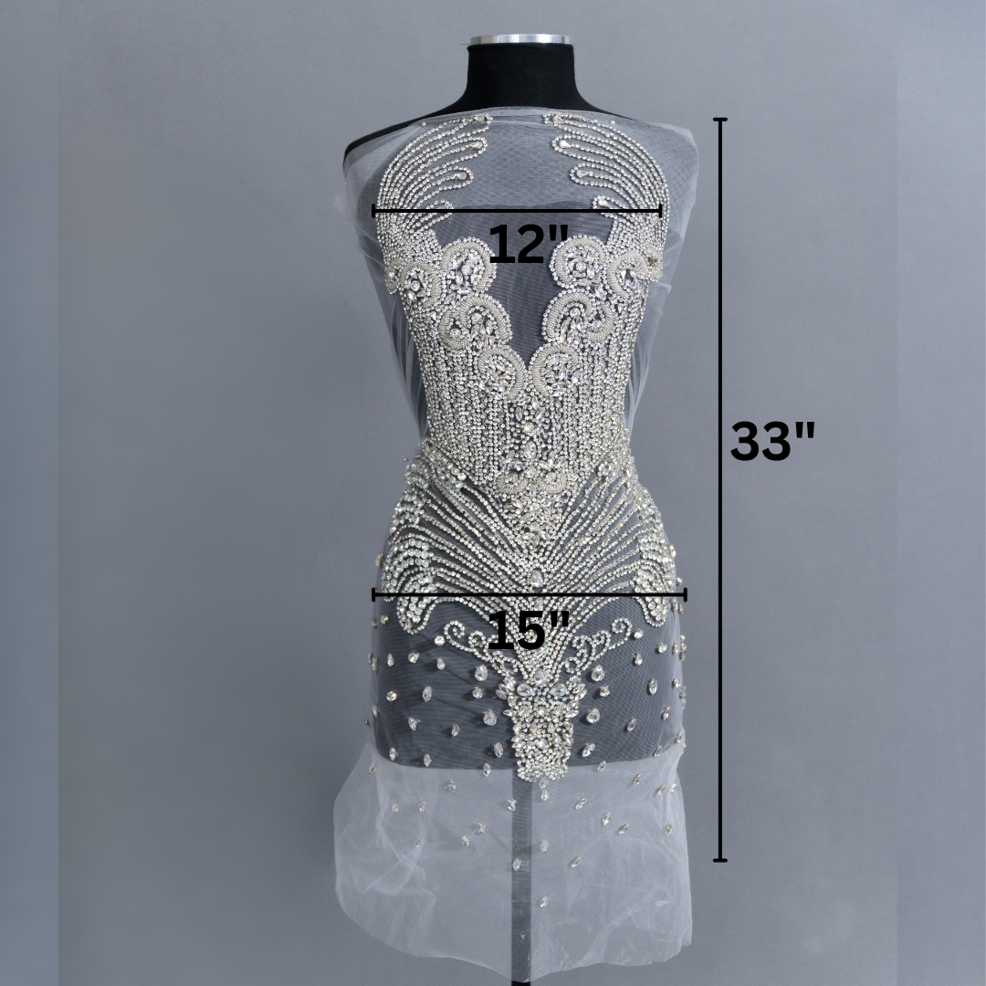 A bodice covered in many silver rhinestones, with labeled measurements.