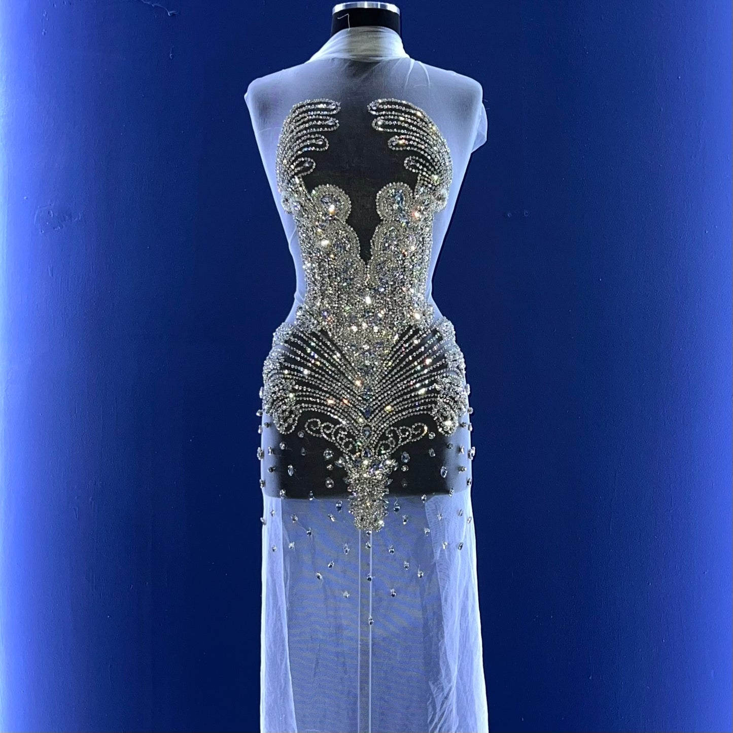 A bodice covered in many silver rhinestones.