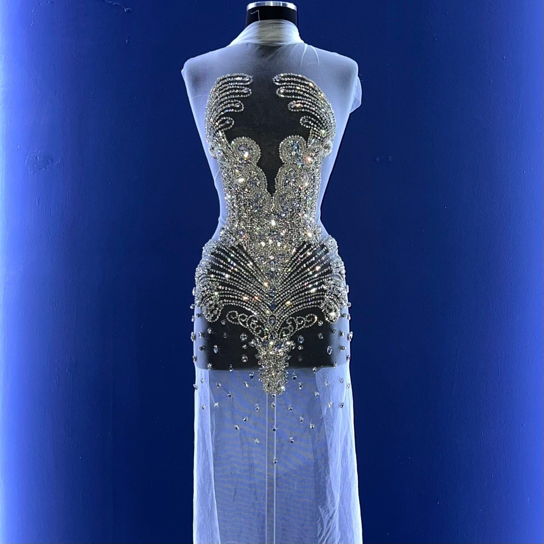 A bodice covered in many silver rhinestones.