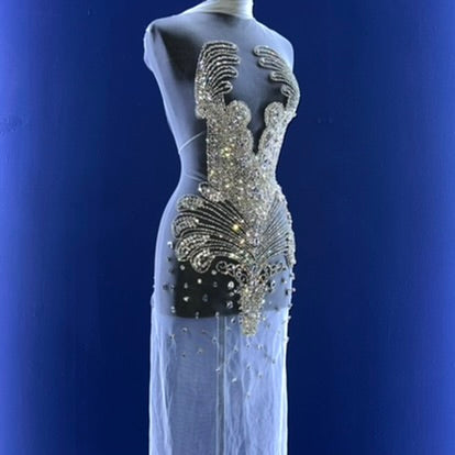 A bodice covered in many silver rhinestones.