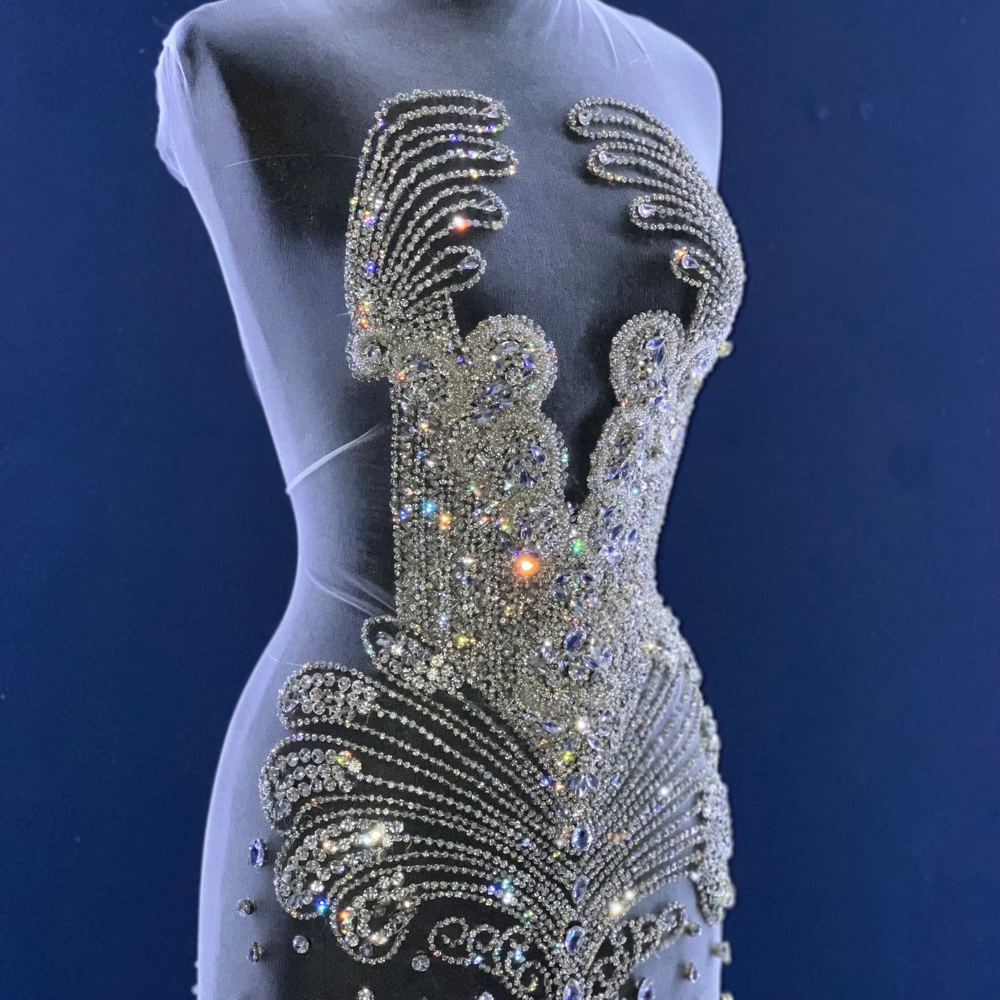 A bodice covered in many silver rhinestones.