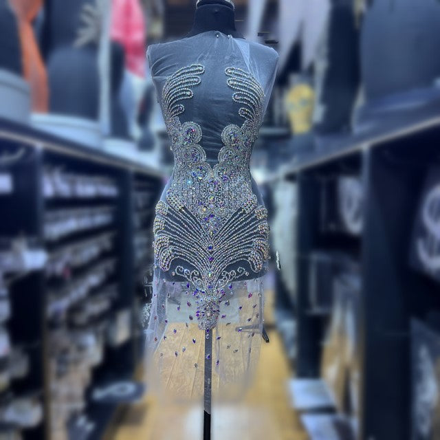A bodice covered in many silver rhinestones.