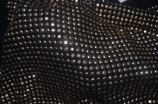 A black t-shirt, bedazzled all over with sparkly rhinestones.