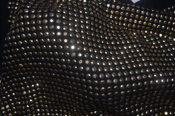 A black t-shirt, bedazzled all over with sparkly rhinestones.