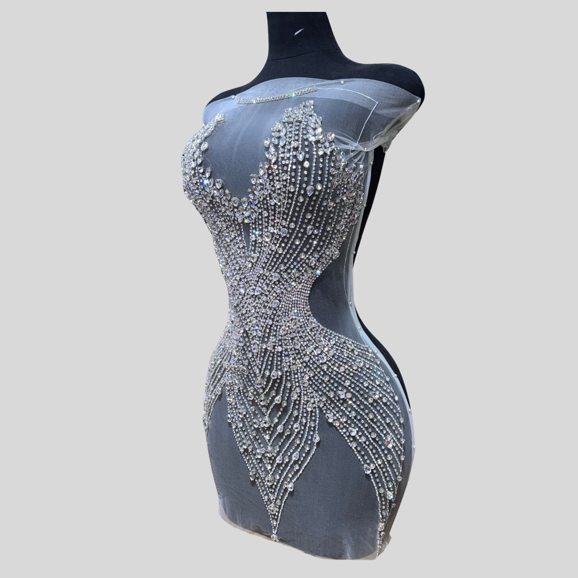 Hand-made rhinestone bodice appliqué with cascading glass rhinestones on sheer mesh, available in silver, gold, and black