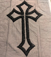Black cross design with sequins on a gray fabric background